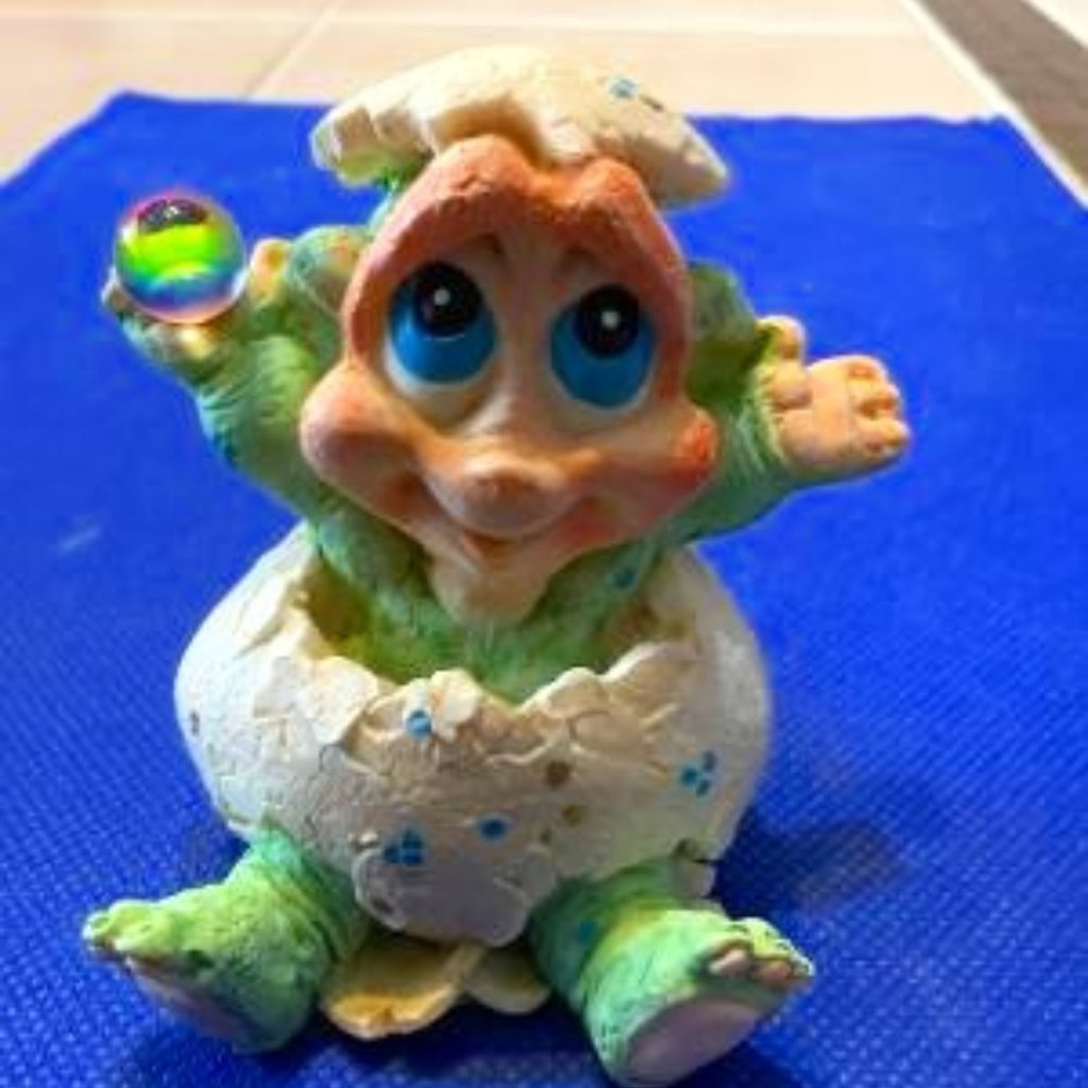 Cute Baby Dinosauer Coming Out of his Egg